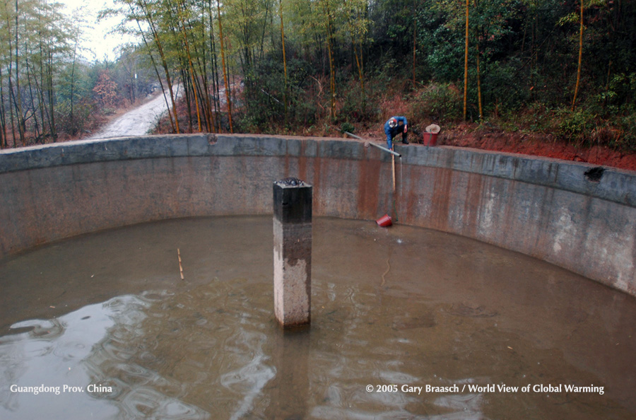 Long term drought in Guangdong Province, China, January 2005, forces desperate dipping for water from depleted reservoir.