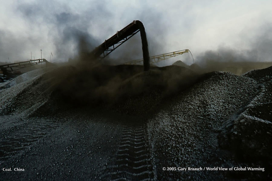 Coal being piled at yard near Baotou, Inner Mongolia, China, where nearby coal mines serve giant powerplants.